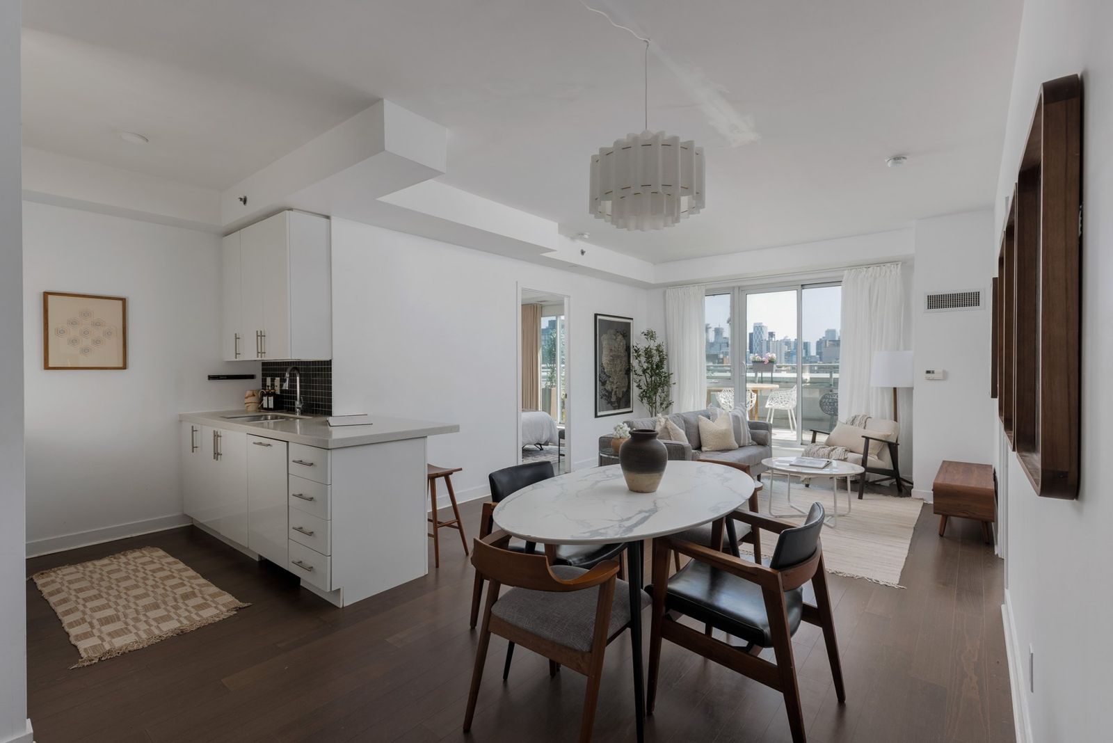 Kitchen and dining with drapery softening the windows