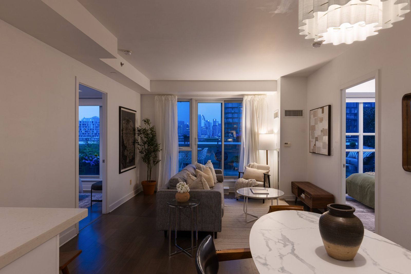 Living and dining with a new sculptural chandelier
