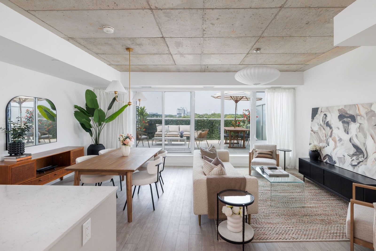 Living and dining room opening onto the staged terrace, Queen Street East