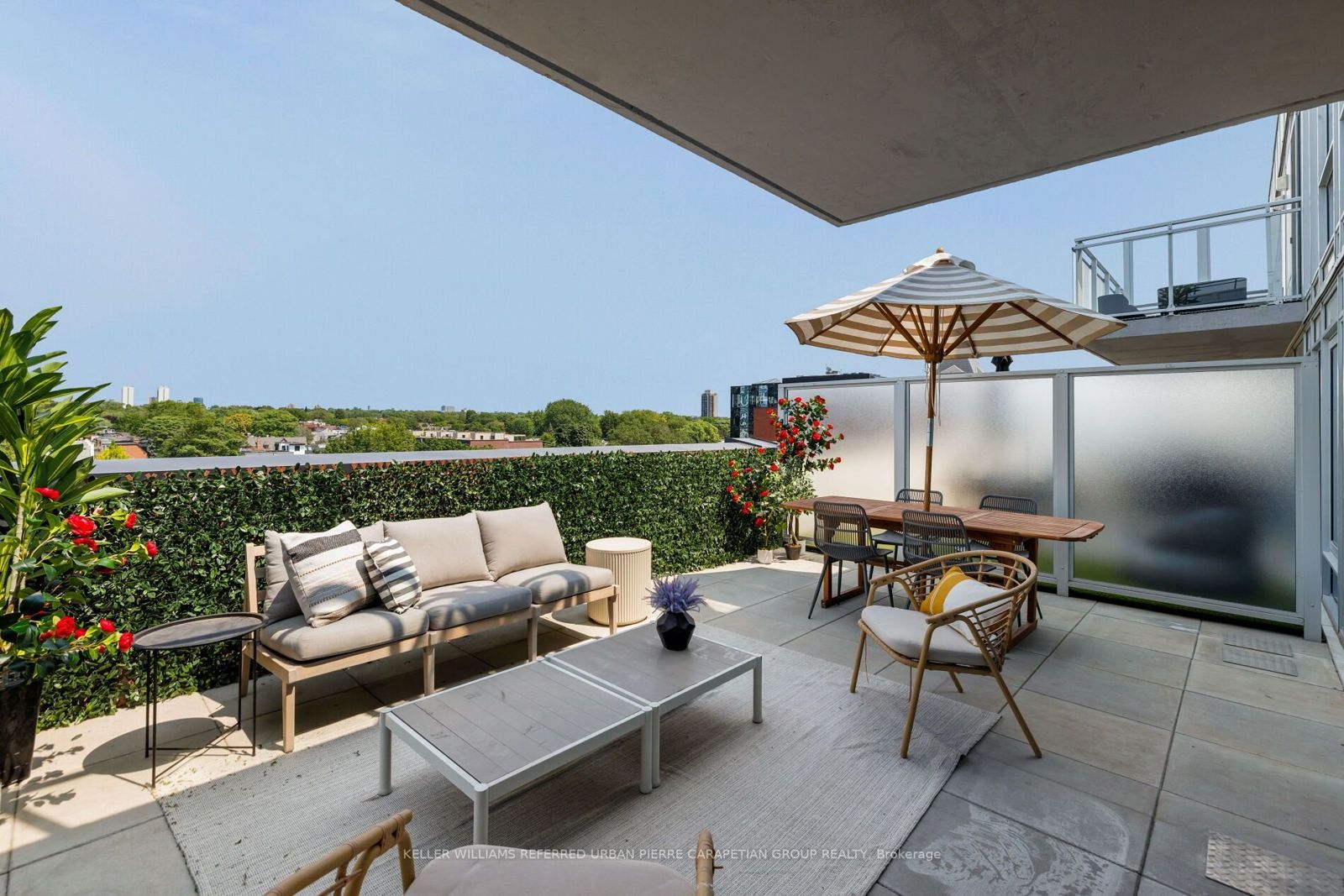 The finished terrace with lounge and dining areas